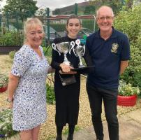 Awards ceremony at the Carrbrook Gardening Competition.  One of the winners with Rotarian Jan Jackson (left) and President Ian Cochrane.